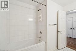 Bathroom featuring shower / tub combination and tile patterned floors - 