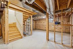 Unfinished basement featuring stairway - 