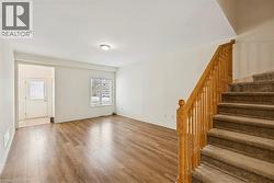 Entryway featuring wood finished floors and stairway - 