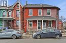 View of front facade with brick siding and a shingled roof - 313 Mary Street, Hamilton, ON  - Outdoor With Facade 