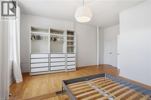 Unfurnished bedroom with light wood finished floors and a closet - 313 Mary Street, Hamilton, ON - Indoor