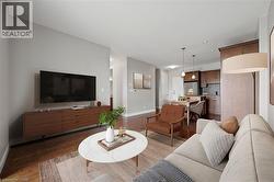 Living area featuring wood finished floors and recessed lighting - 