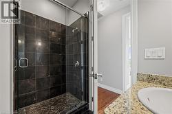 Full bath with a shower stall, wood finished floors, and vanity - 