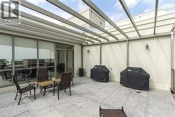 View of patio / terrace featuring grilling area and a pergola - 