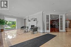 Building lobby featuring ornamental molding and recessed lighting - 