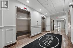 Common area with a decorative wall, a wainscoted wall, and recessed lighting - 