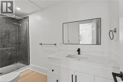 Full bathroom with vanity, a marble finish shower, light wood-type flooring, and recessed lighting - 93 John Street S, Hamilton, ON 