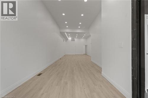 Hallway with recessed lighting and light wood-type flooring - 93 John Street S, Hamilton, ON 