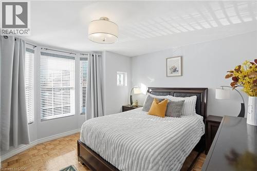 Lots of windows bringing in tons of natural light! - 81 Simcoe Street E, Hamilton, ON - Indoor Photo Showing Bedroom