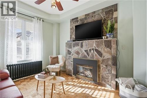 Gas fireplace to cozy up to during the winter months! - 81 Simcoe Street E, Hamilton, ON - Indoor Photo Showing Living Room With Fireplace
