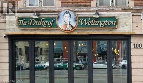 Property entrance with brick siding and french doors - 100 King Street S, Waterloo, ON 