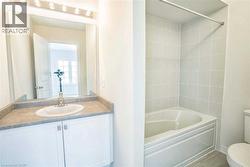 Full bath with vanity, washtub / shower combination, and toilet - 