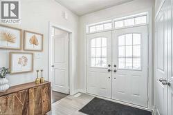 Entryway featuring baseboards and french doors - 