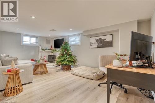 Office featuring a wood stove and light hardwood / wood-style flooring - 99 East 36Th Street, Hamilton, ON - Indoor