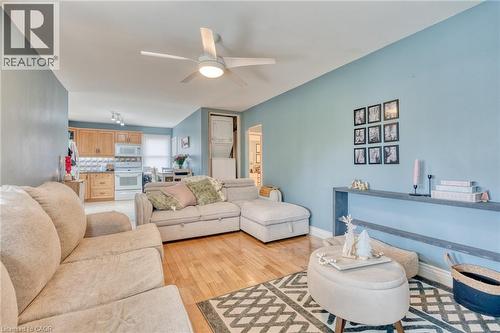 Living room featuring ceiling fan and light hardwood / wood-style floors - 99 East 36Th Street, Hamilton, ON - Indoor Photo Showing Living Room
