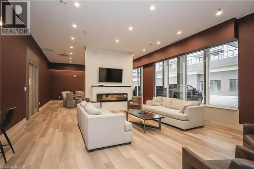 Amenities - 560 North Service Road Unit# 304, Grimsby, ON - Indoor Photo Showing Living Room With Fireplace