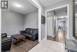 Living area featuring wood finished floors and a textured ceiling - 