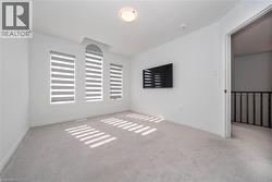 Spare room with carpet and baseboards - 