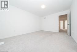 Unfurnished room with light carpet - 