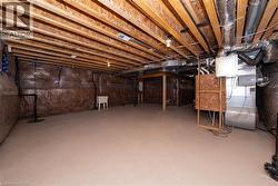 Unfinished below grade area featuring a sink and drainage system - 