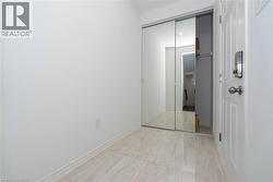 Unfurnished bedroom with a closet and baseboards - 