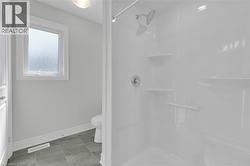 Full bathroom with toilet and a shower stall - 