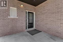 Entrance to property with brick siding - 
