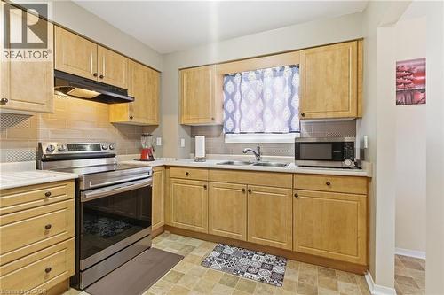 185 Denistoun Street Unit# 116, Welland, ON - Indoor Photo Showing Kitchen With Double Sink
