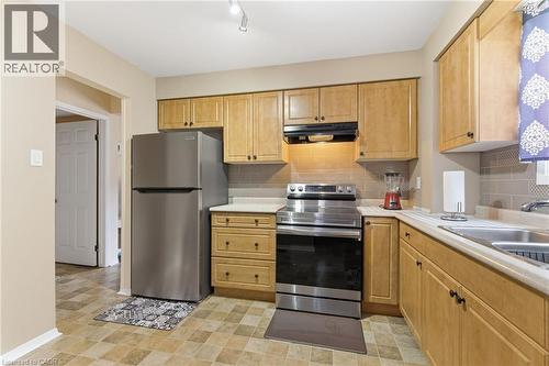 185 Denistoun Street Unit# 116, Welland, ON - Indoor Photo Showing Kitchen With Double Sink