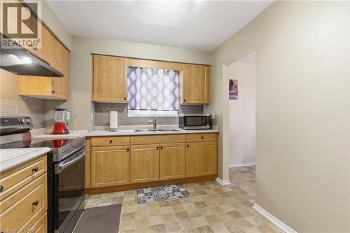 185 Denistoun Street Unit# 116, Welland, ON - Indoor Photo Showing Kitchen With Double Sink
