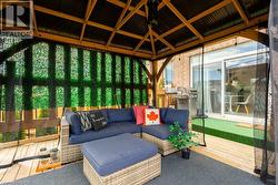 Sunroom / solarium featuring outdoor lounge area and plenty of natural light - 