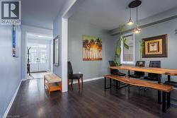 Dining room featuring baseboards, french doors, and wood finished floors - 