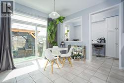 Dining room with light tile patterned floors - 