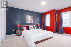 Carpeted bedroom featuring baseboards - 