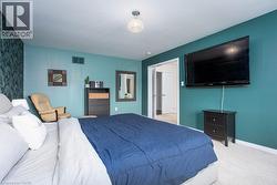 Bedroom featuring baseboards, visible vents, and carpet floors - 