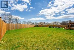 View of yard featuring a fenced backyard - 