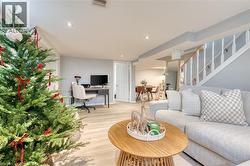 Living room with light wood-type flooring - 