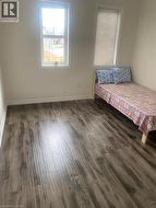 Bedroom with dark wood-type flooring - 