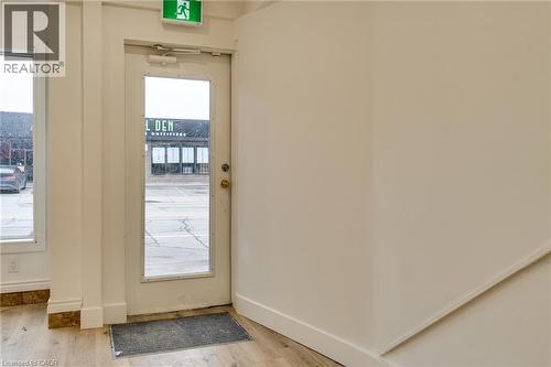 Entryway with wood finished floors - 18 Barton Street E Unit# A, Hamilton, ON 