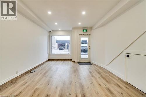 Empty room featuring light wood-type flooring and recessed lighting - 18 Barton Street E Unit# A, Hamilton, ON 
