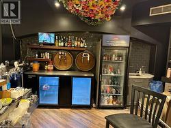 Community bar area with wine cooler and open shelves - 