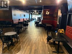 Dining room featuring wood finished floors - 