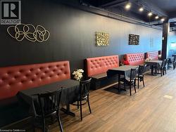 Dining area featuring wood finished floors and track lighting - 