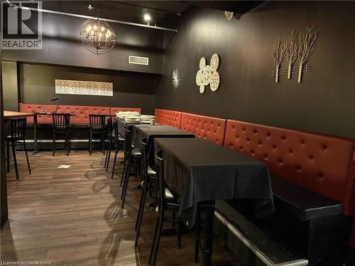 Dining room with wood finished floors - 179 King Street W, Kitchener, ON 