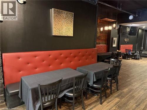 Dining area featuring wood finished floors - 179 King Street W, Kitchener, ON 