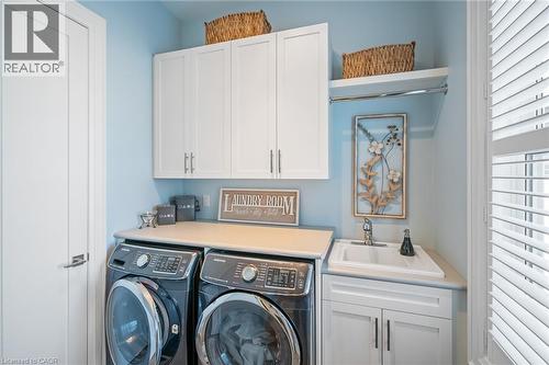 Main Floor Laundry complete with storage and shelving - 507 Mississagua Street, Niagara-On-The-Lake, ON - Indoor Photo Showing Laundry Room