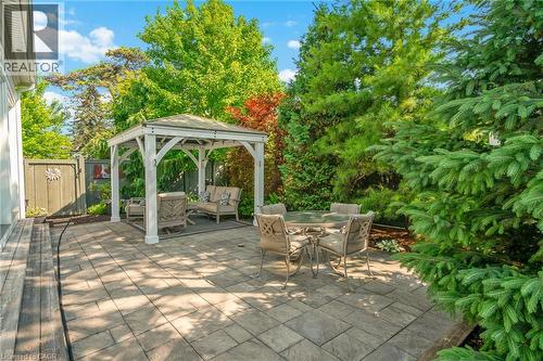 Low Maintenence rear yard complete with gazebo and mature trees - 507 Mississagua Street, Niagara-On-The-Lake, ON - Outdoor With Deck Patio Veranda With Backyard