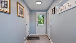 Entryway with baseboards and tile patterned floors - 