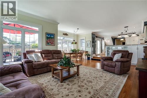 Living room with plenty of natural light, hardwood / wood-style flooring, and crown molding - 849 Beach Boulevard, Hamilton, ON - Indoor Photo Showing Living Room