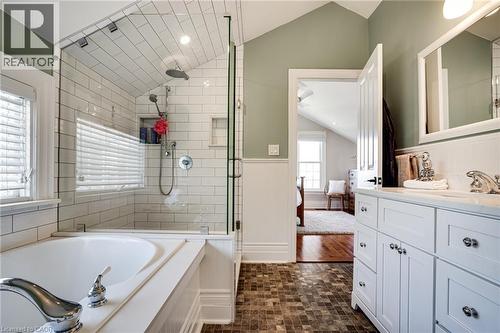 Ensuite bathroom featuring lofted ceiling, vanity, a stall shower, and a bath - 849 Beach Boulevard, Hamilton, ON - Indoor Photo Showing Bathroom